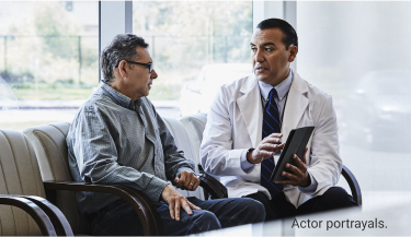 Actor portrayals of male doctor with male patient using digital tablet as discussion tool