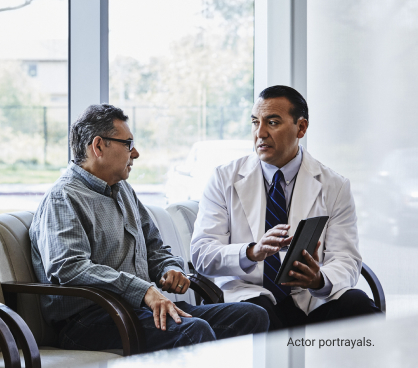 Actor portrayals of male doctor with male patient using digital tablet as discussion tool